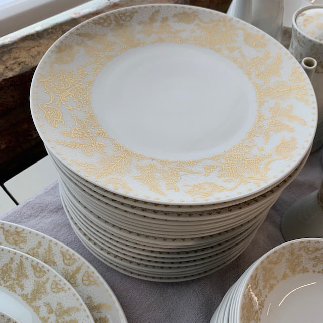 A gorgeous dinner service made by Rosenthal (Germany)  famous artist, Bjorn Wiinblad. The pattern is "Idyll"  Beautifully executed in rich gold, on exquisite purest white porcelain, it is a beautiful set and looks great on the table. The forms, too, are marvelous, contemporary and very elegant. Studio Sonja Milan, Gold and white dinnerware for 12 people.