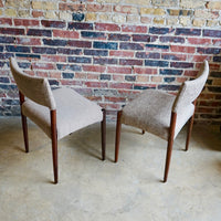 Set of 4 Danish modern dining chairs. Set includes 2 armchairs and 2 side chairs. Upholstery is in shades of cream and light browns. Upholstery is in very good condition. 