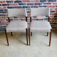 Set of 4 Danish modern dining chairs. Set includes 2 armchairs and 2 side chairs. Upholstery is in shades of cream and light browns. Upholstery is in very good condition. 