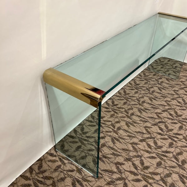 Glass and Brass console table, Leon Rosen, produced by Pace Furniture 62.25"W x 15"D x 27"H We have 2 identical tables currently in stock. Studio Sonja Milan, Chicago, IL Hollywood Regency, Glam,  Palm Beach Style, Waterfall Style Sofa Table, Studio Sonja Milan, Chicago, IL, Ships nationwide, free local delivery