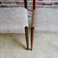 Set of 4 Danish modern dining chairs. Set includes 2 armchairs and 2 side chairs. Upholstery is in shades of cream and light browns. Upholstery is in very good condition. 