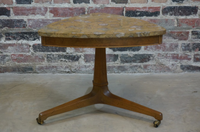 Beautiful petite side table with a pecan tripod base, small hooded brass casters and a Pernige marble (marble from Portugal with beautiful fossil detail) top. 