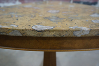 Beautiful petite side table with a pecan tripod base, small hooded brass casters and a Pernige marble (marble from Portugal with beautiful fossil detail) top. 