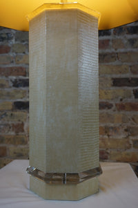 Mid-century faux snakeskin and lucite table lamp.