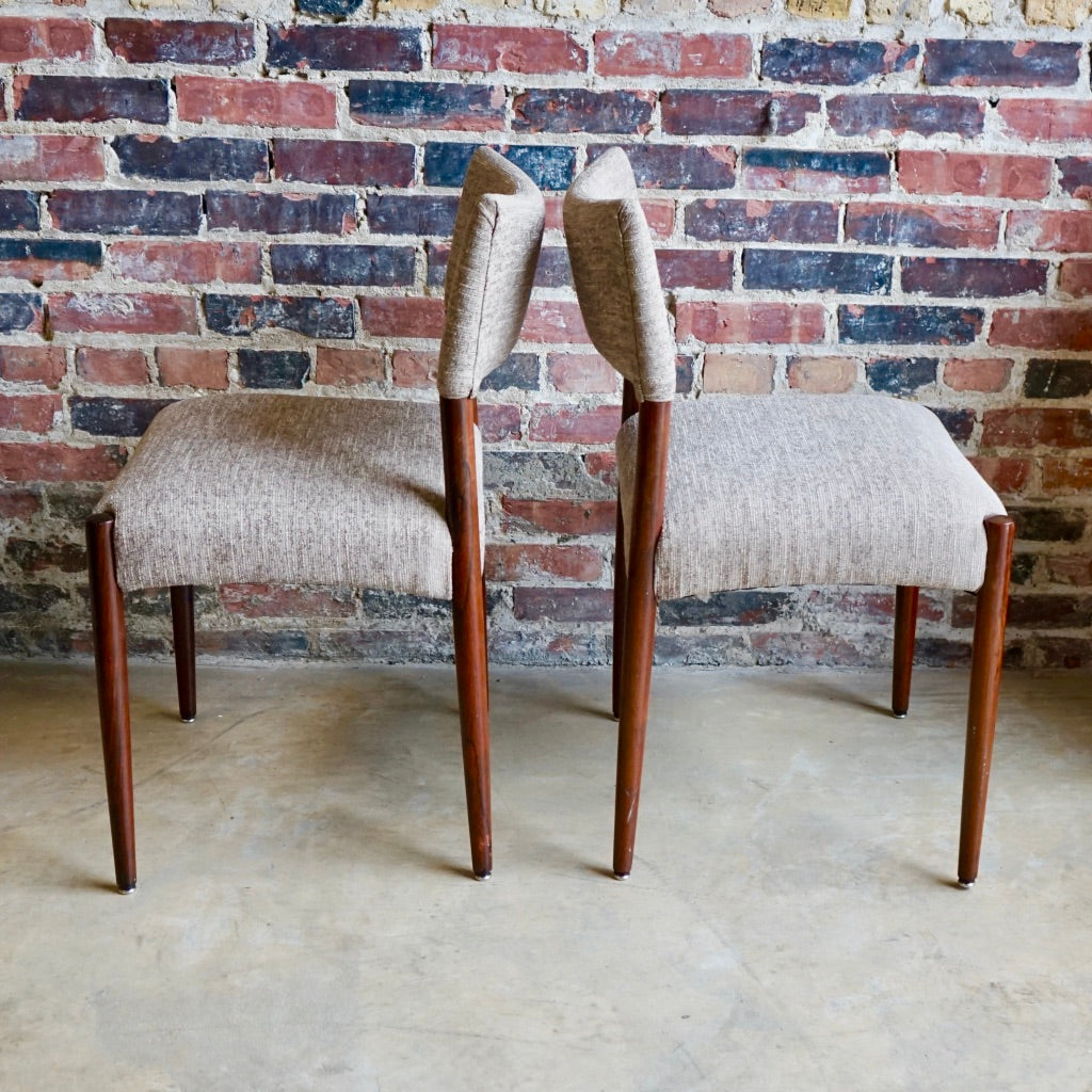 Set of 4 Danish modern dining chairs. Set includes 2 armchairs and 2 side chairs. Upholstery is in shades of cream and light browns. Upholstery is in very good condition. 