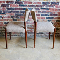 Set of 4 Danish modern dining chairs. Set includes 2 armchairs and 2 side chairs. Upholstery is in shades of cream and light browns. Upholstery is in very good condition. 