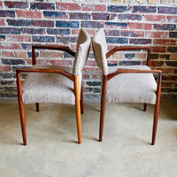 Set of 4 Danish modern dining chairs. Set includes 2 armchairs and 2 side chairs. Upholstery is in shades of cream and light browns. Upholstery is in very good condition. 