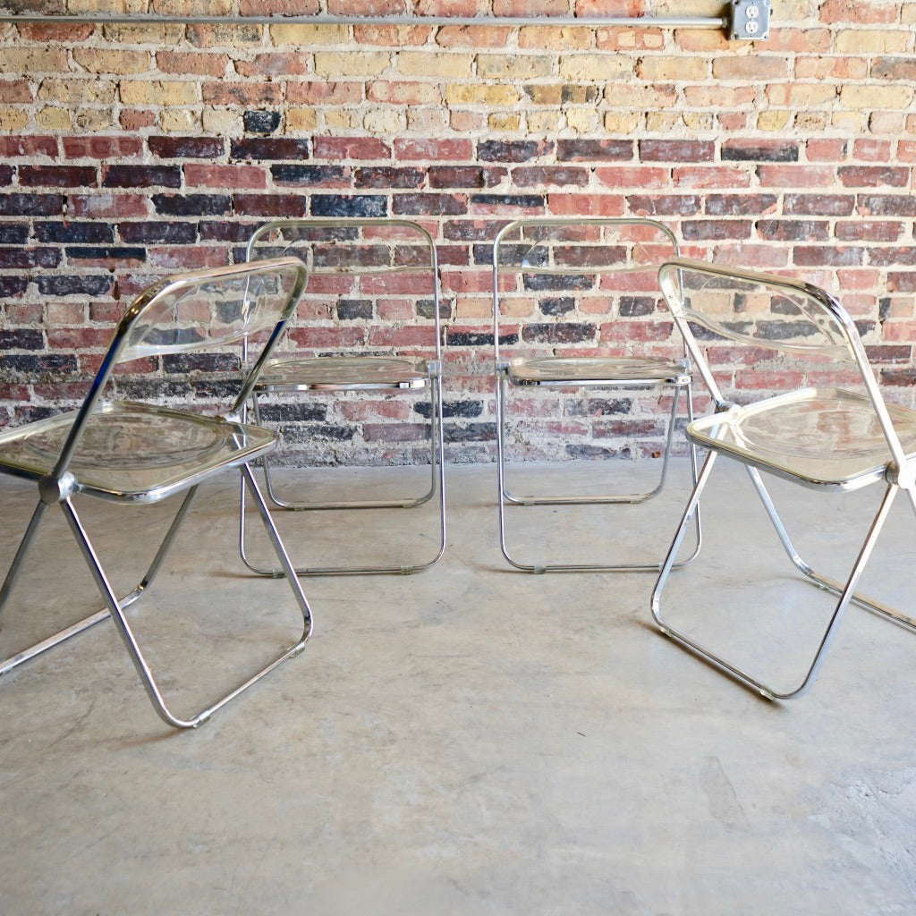"Plia" clear acrylic folding chairs by Giancarlo Piretti for Castelli