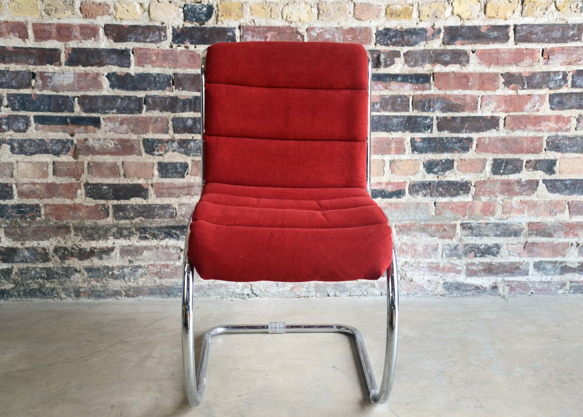 Set of mid-century dining chairs, chrome wire frames and cantilevered design. Red upholstery is snapped in place on the frame. Similar to the Willy Rizzo for Cidue Italy