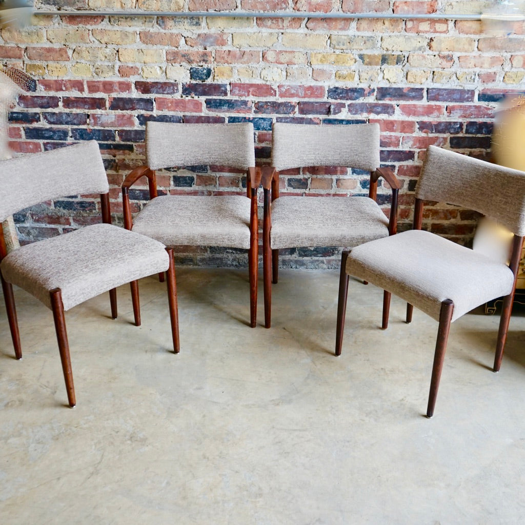 Set of 4 Danish modern dining chairs. Set includes 2 armchairs and 2 side chairs. Upholstery is in shades of cream and light browns. Upholstery is in very good condition. 